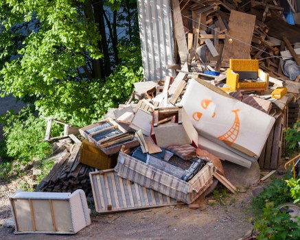 Highbury business site with an enclosed skip